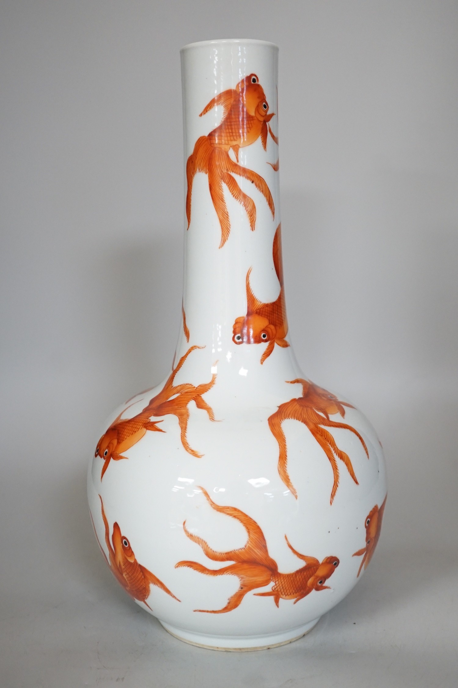 A Chinese iron red enamelled goldfish bottle vase. 35cm tall